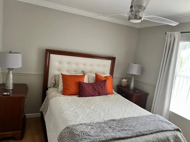 a bedroom with a bed and a fireplace