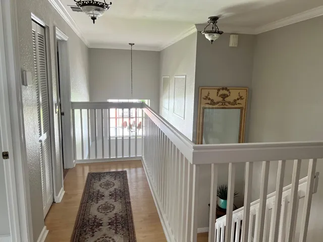 a view of a hallway with windows