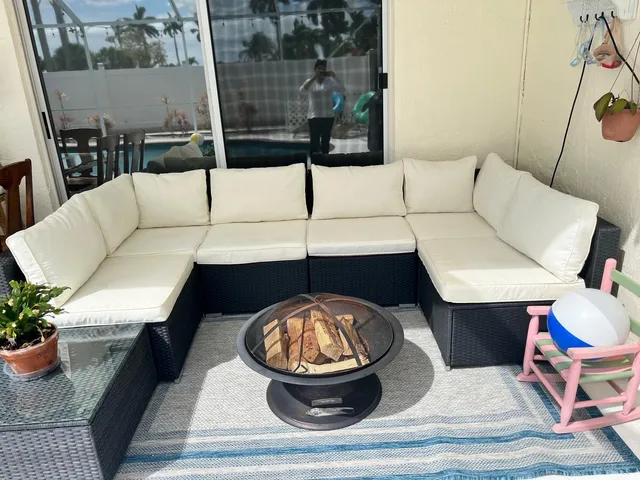 a view of a dining room with furniture and a chandelier