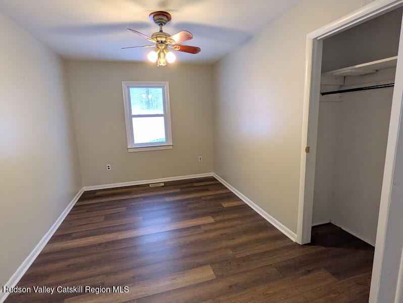 474 Dibble Road Hobart, NY 13788 - Photo 11 of 29 a view of an empty room with wooden floor and a window