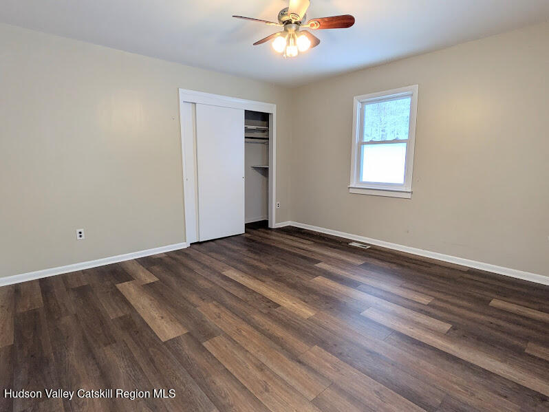 474 Dibble Road Hobart, NY 13788 - Photo 12 of 29 wooden floor in an empty room with a window