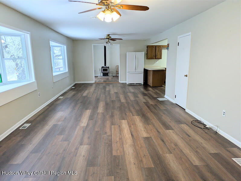 474 Dibble Road Hobart, NY 13788 - Photo 9 of 29 wooden floor in an empty room with a window