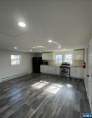 a view of a kitchen with a sink and a window