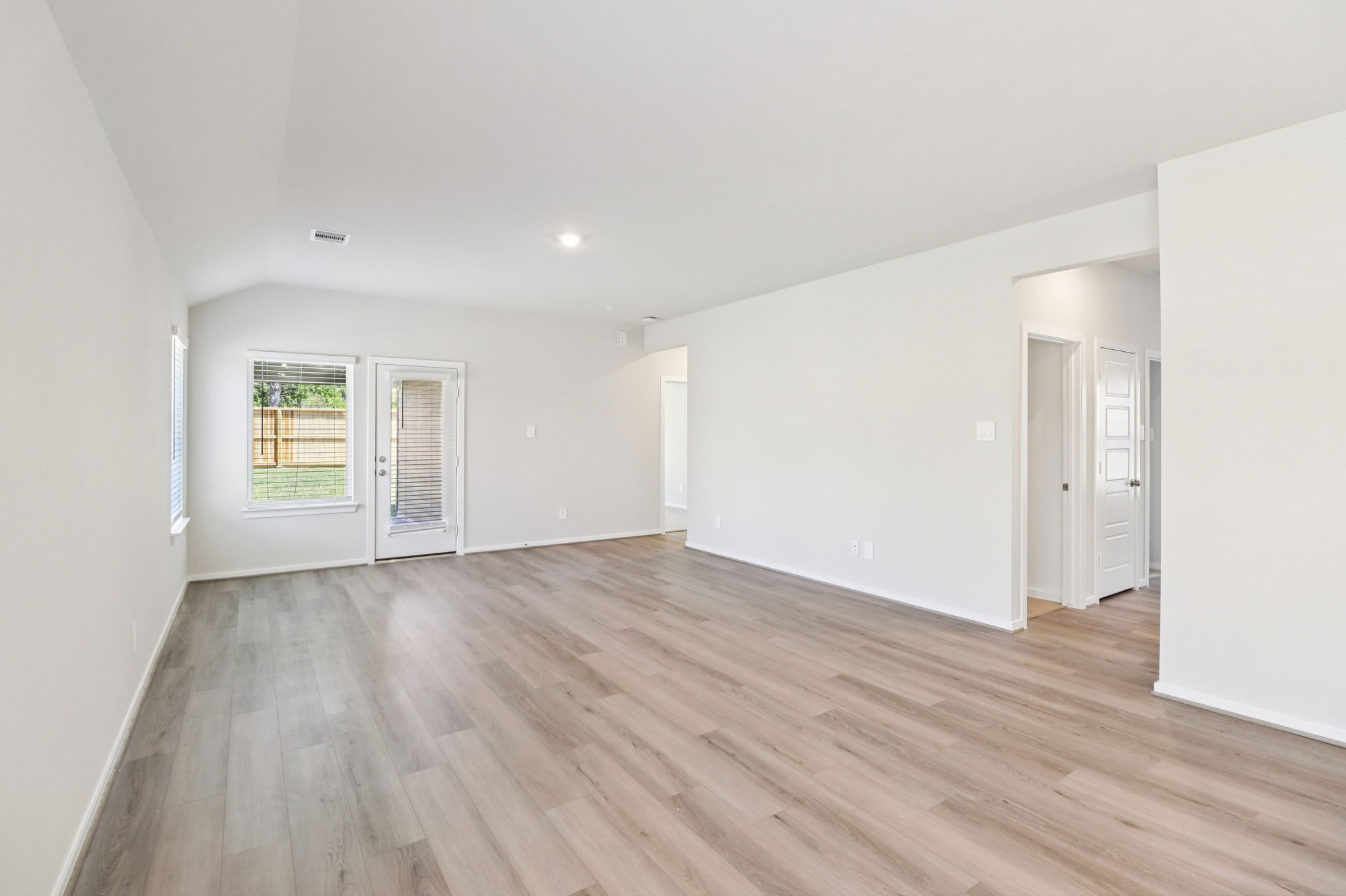 16273 Parish Pointe Court Conroe, TX 77302 - Photo 6 of 29 wooden floor in an empty room with a window