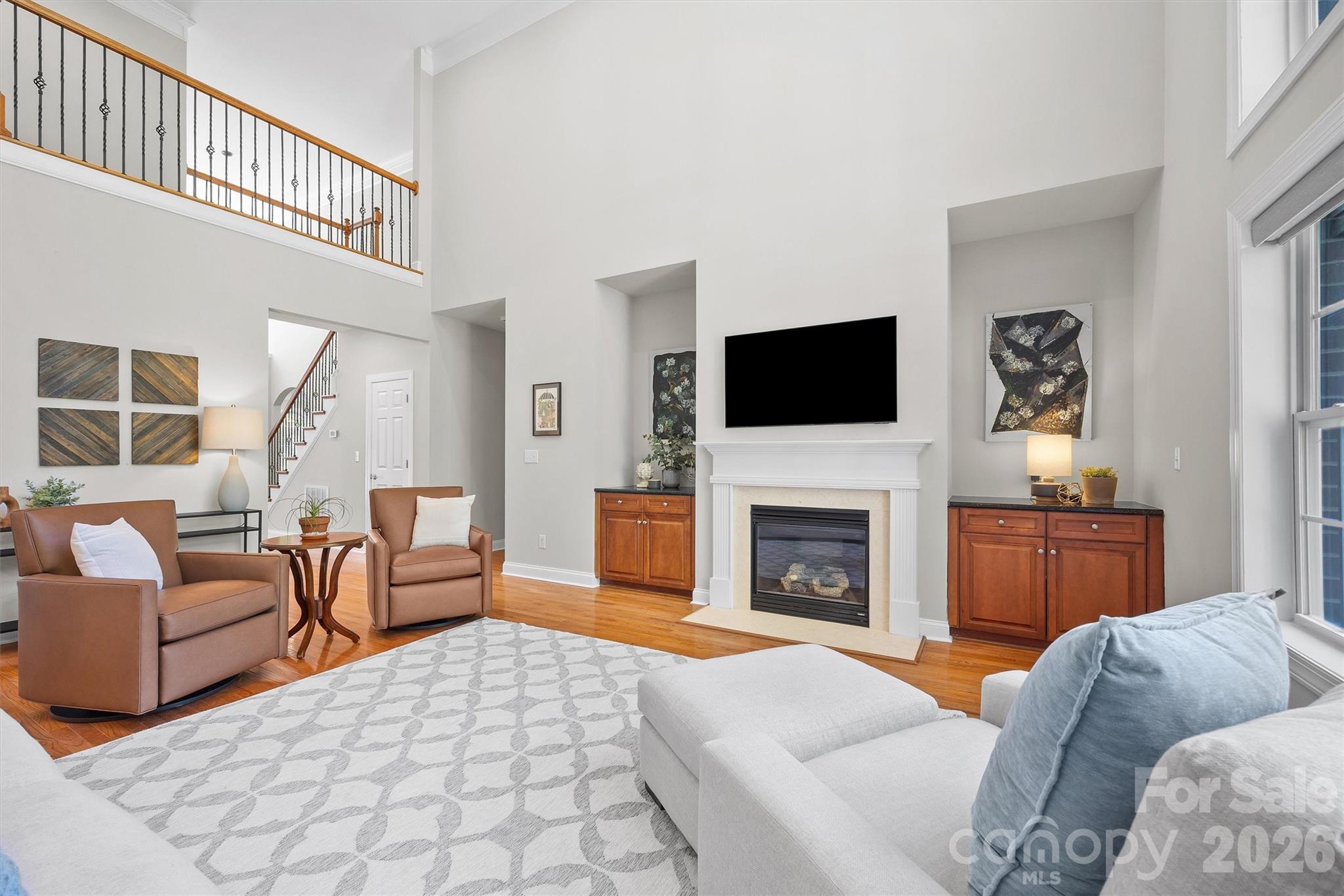 5103 Trinity Trace Lane Monroe, NC 28110 - Photo 12 of 48 a living room with furniture a fireplace and a flat screen tv