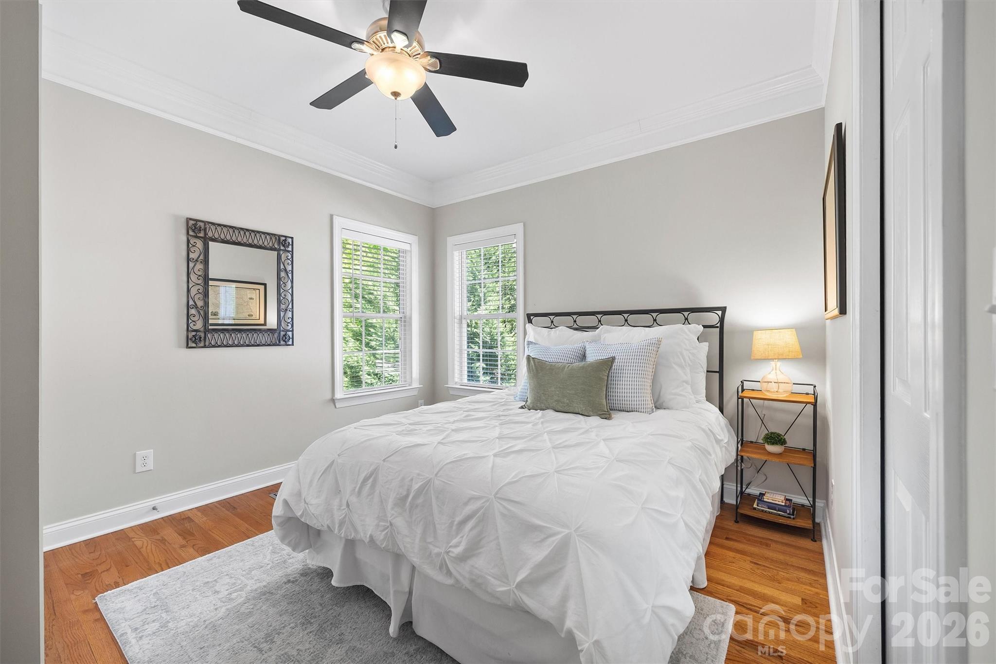 5103 Trinity Trace Lane Monroe, NC 28110 - Photo 17 of 48 a bedroom with a bed and wooden floor