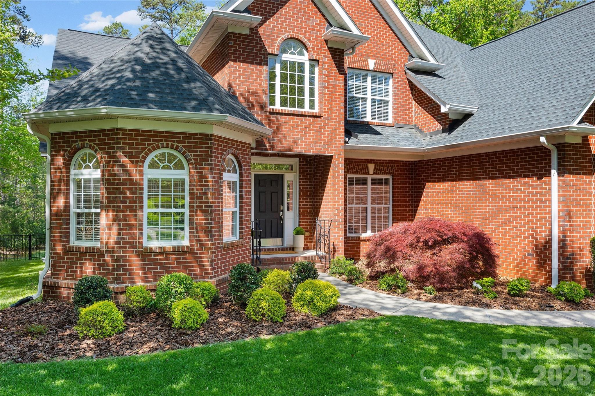5103 Trinity Trace Lane Monroe, NC 28110 - Photo 2 of 48 a front view of a house with garden