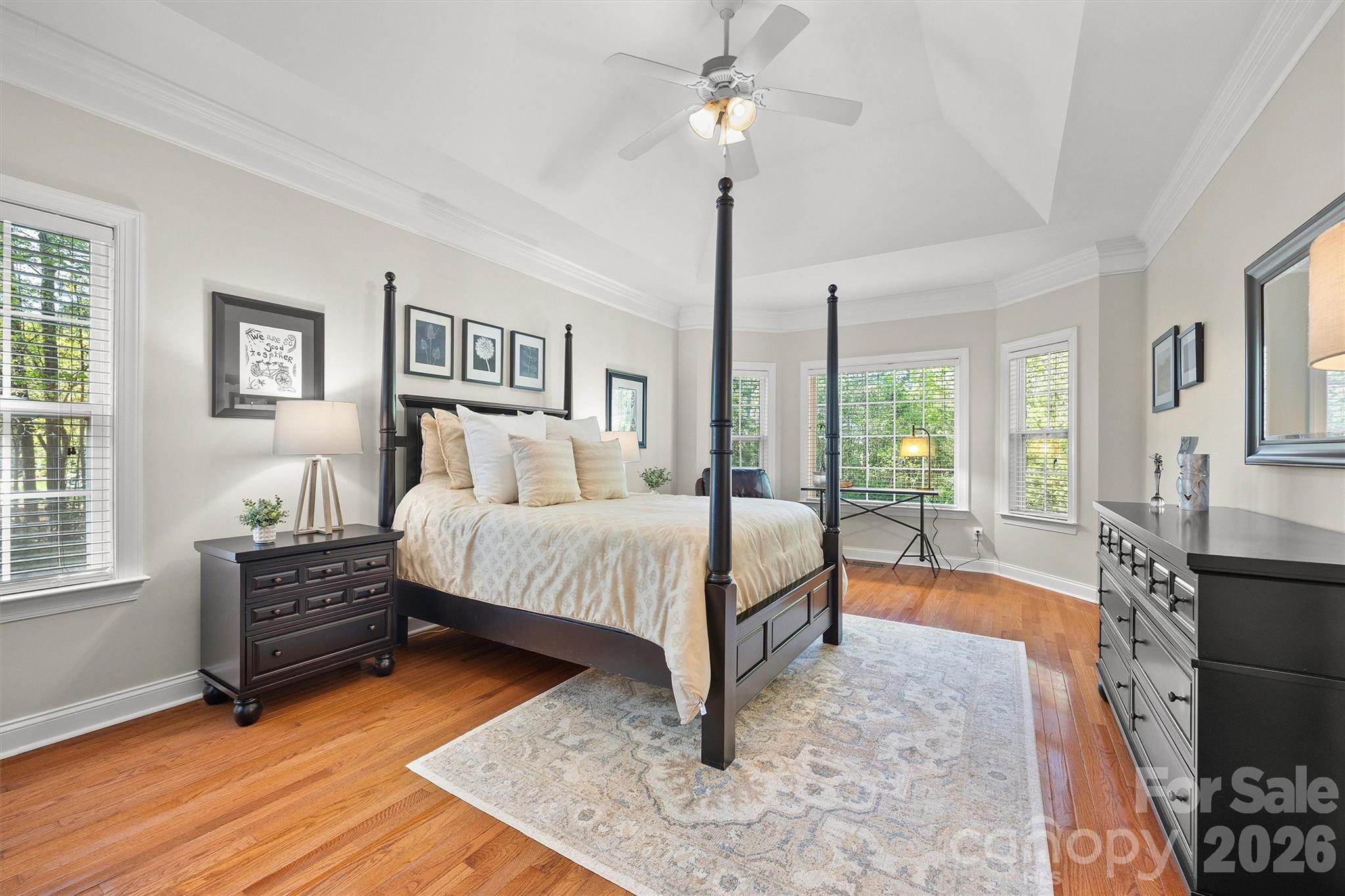 5103 Trinity Trace Lane Monroe, NC 28110 - Photo 21 of 48 a spacious bedroom with a bed a dresser and a window