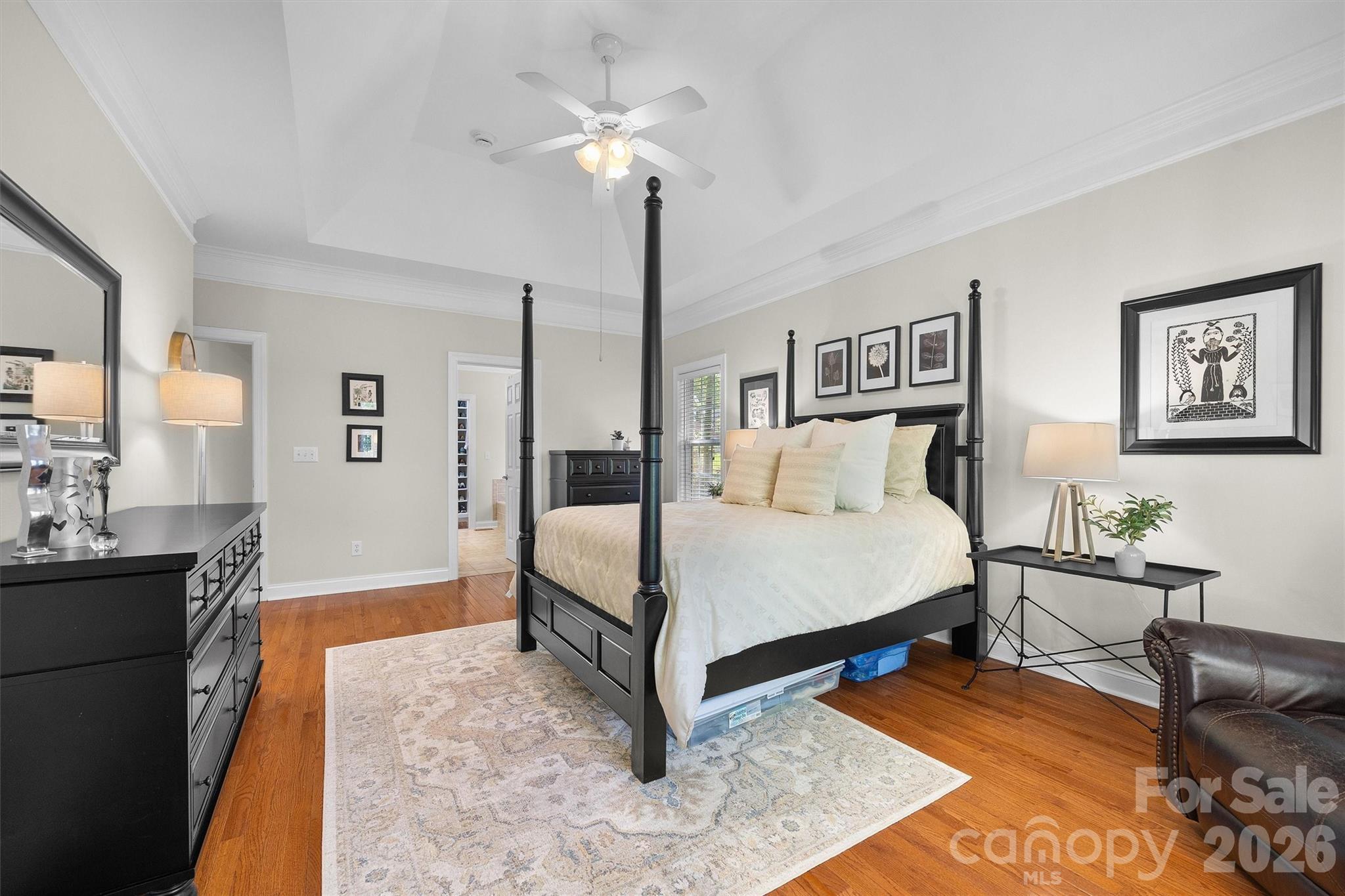 5103 Trinity Trace Lane Monroe, NC 28110 - Photo 22 of 48 a bed room with a bed and a chandelier