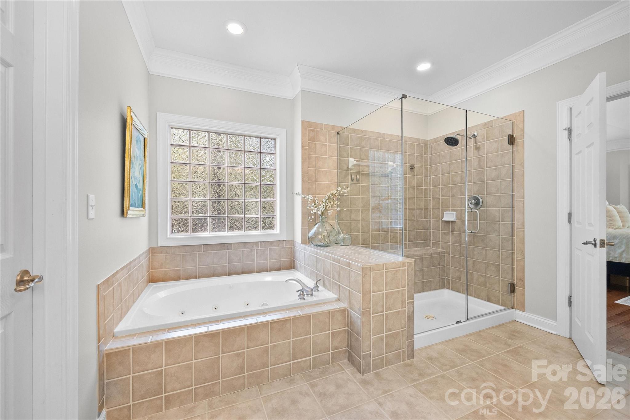 5103 Trinity Trace Lane Monroe, NC 28110 - Photo 26 of 48 a spacious bathroom with a tub shower and checkered floor