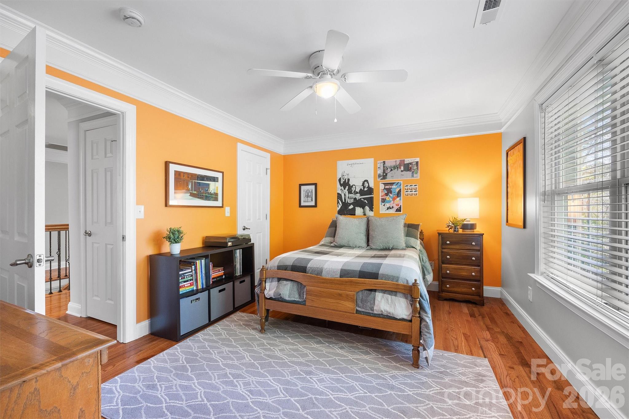 5103 Trinity Trace Lane Monroe, NC 28110 - Photo 37 of 48 a bedroom with bed and wooden floor