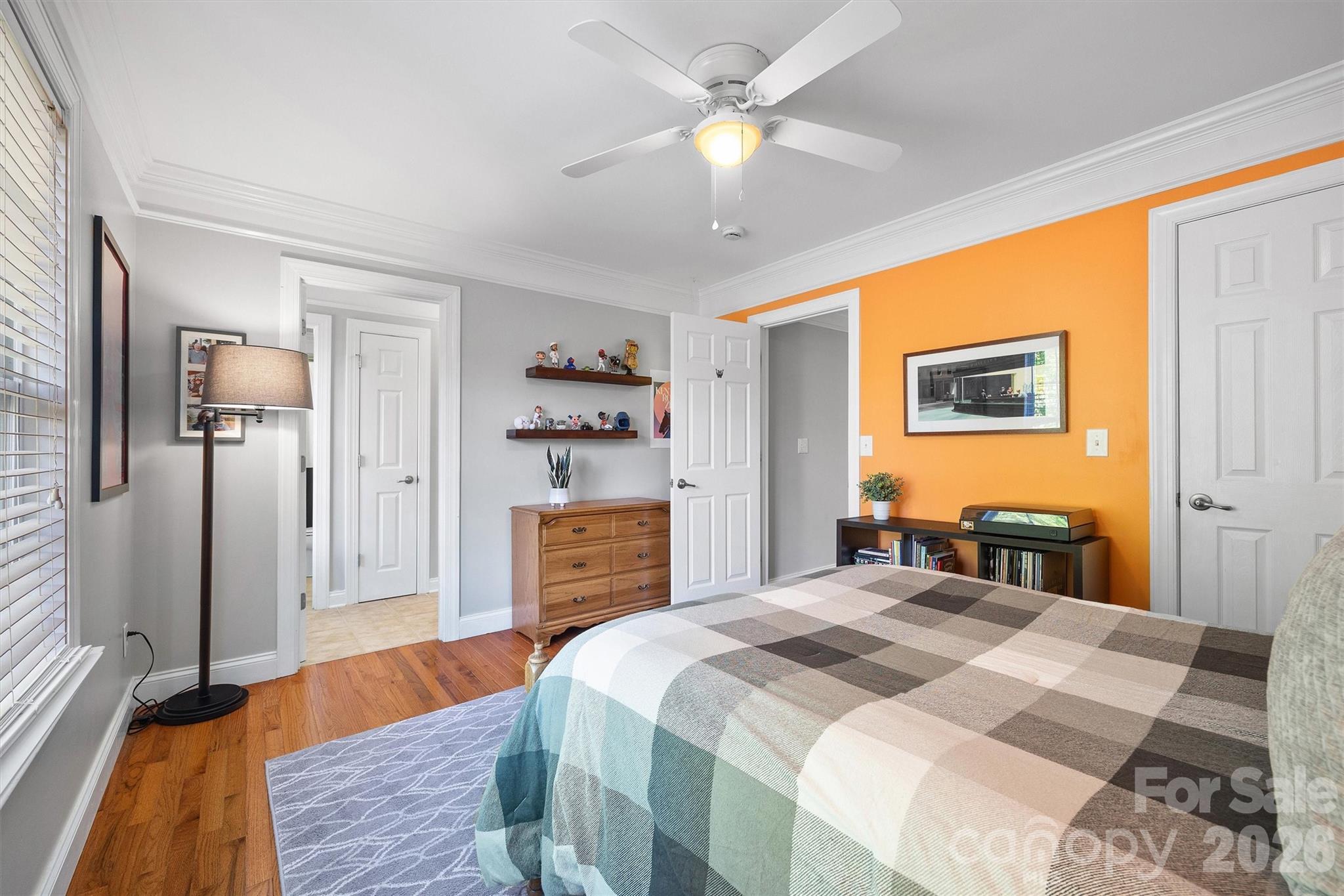 5103 Trinity Trace Lane Monroe, NC 28110 - Photo 38 of 48 a bedroom with a bed and a chandelier