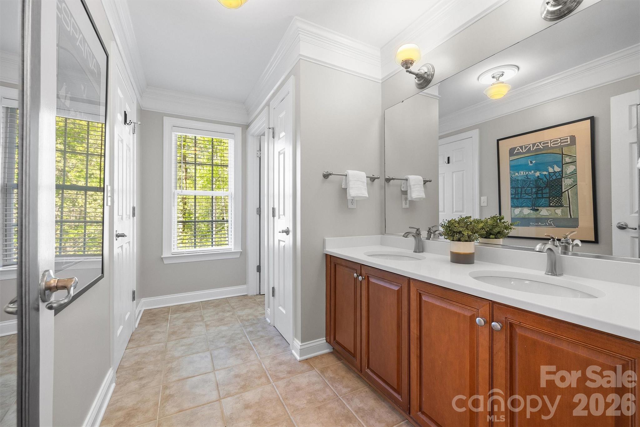 5103 Trinity Trace Lane Monroe, NC 28110 - Photo 40 of 48 a bathroom with a double vanity sink a mirror and a bathtub