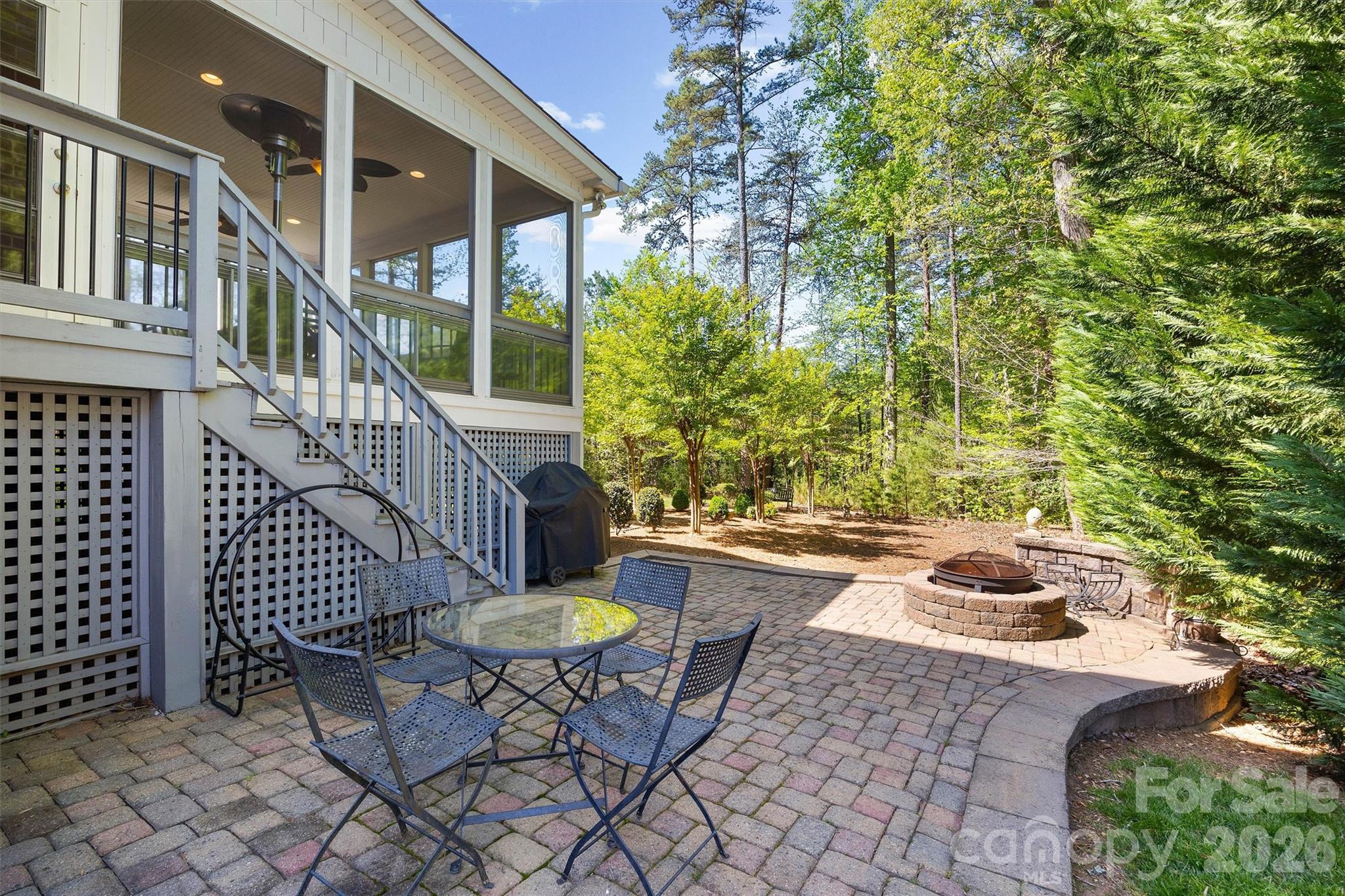 5103 Trinity Trace Lane Monroe, NC 28110 - Photo 43 of 48 a view of a chair and tables in the patio