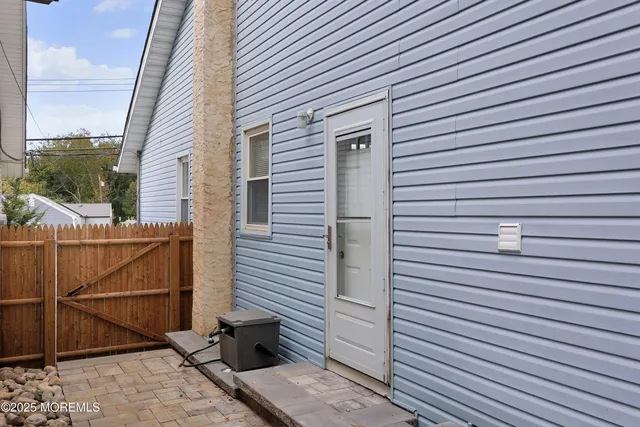 a view of a backyard with a small cabin and a chair