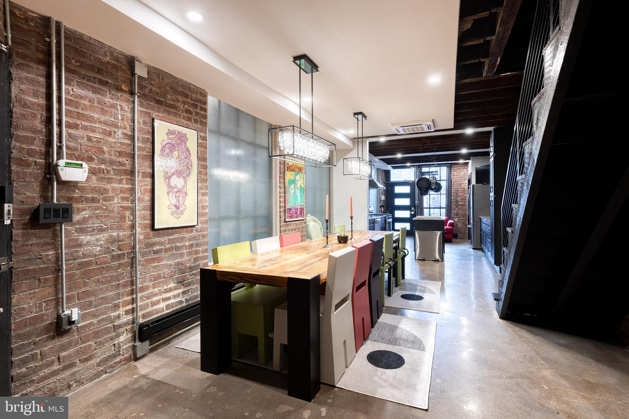 862 Tyson Street Baltimore, MD 21201 - Photo 17 of 62 a dining hall with stainless steel appliances kitchen island granite countertop a sink and cabinets