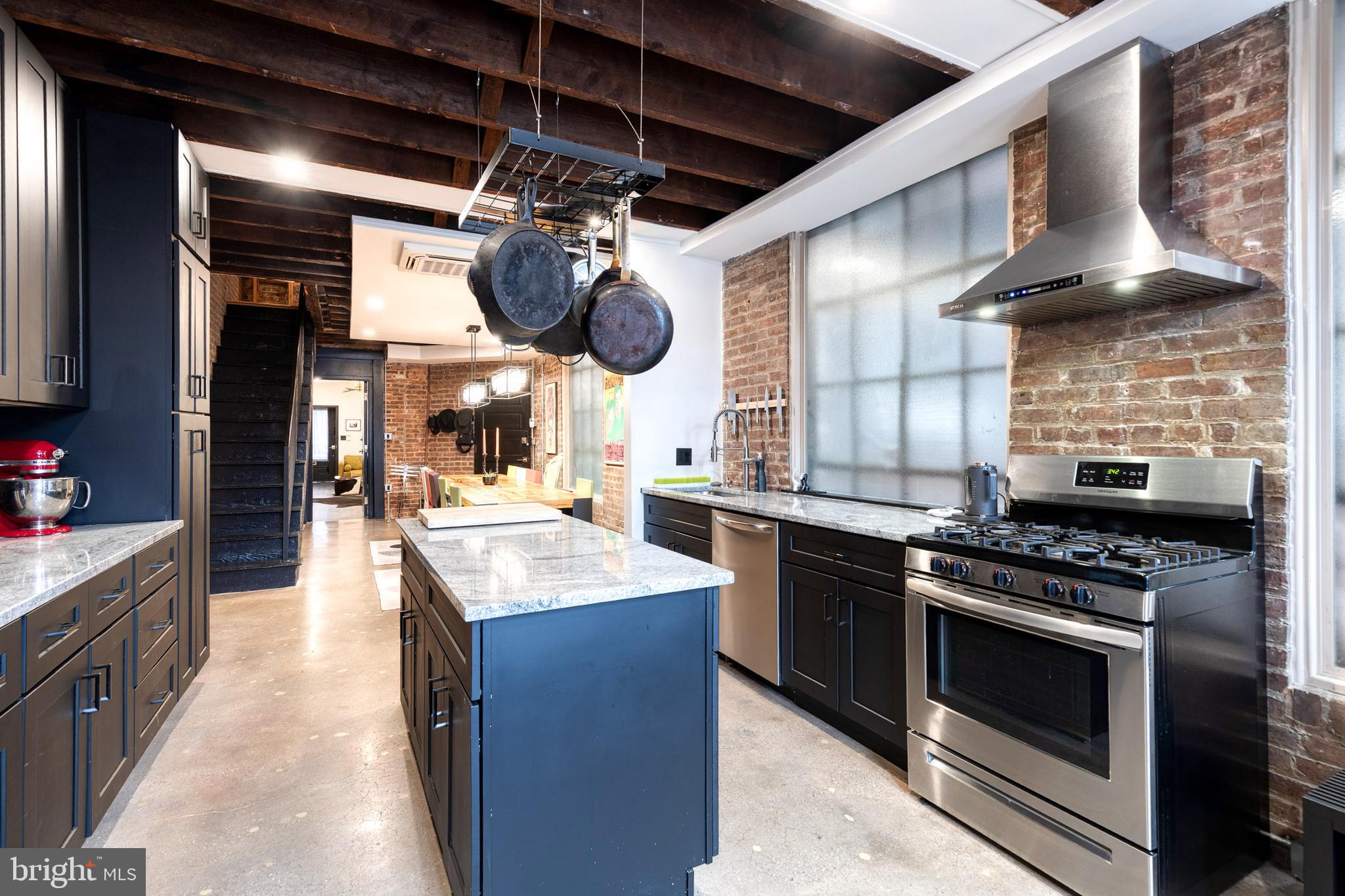 862 Tyson Street Baltimore, MD 21201 - Photo 20 of 62 a kitchen with a stove and a wooden floor