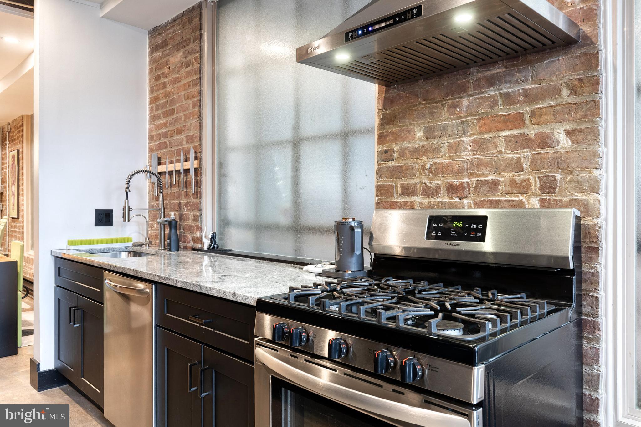 862 Tyson Street Baltimore, MD 21201 - Photo 22 of 62 a kitchen with a stove and a sink