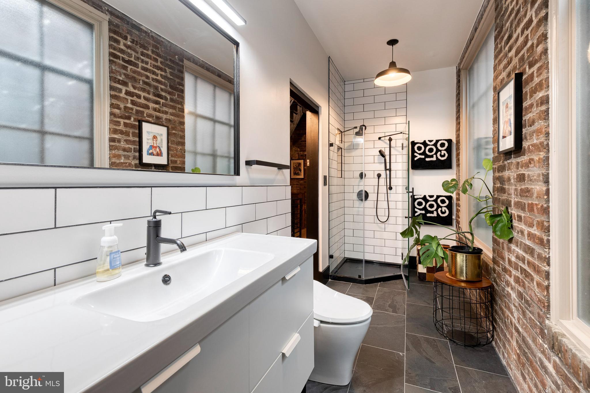862 Tyson Street Baltimore, MD 21201 - Photo 32 of 62 a bathroom with a sink toilet and shower
