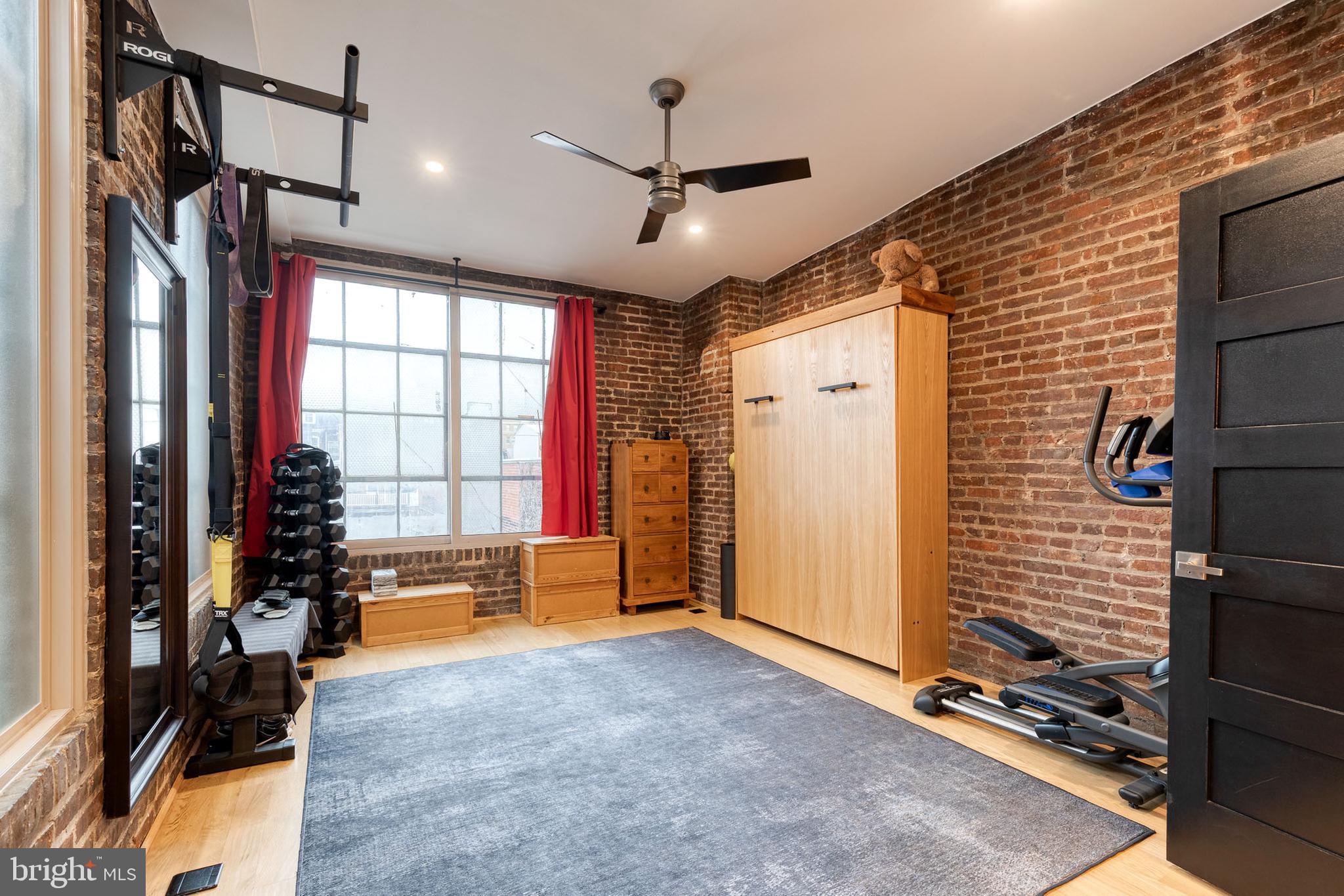 862 Tyson Street Baltimore, MD 21201 - Photo 35 of 62 a view of livingroom with hardwood floor and a ceiling fan