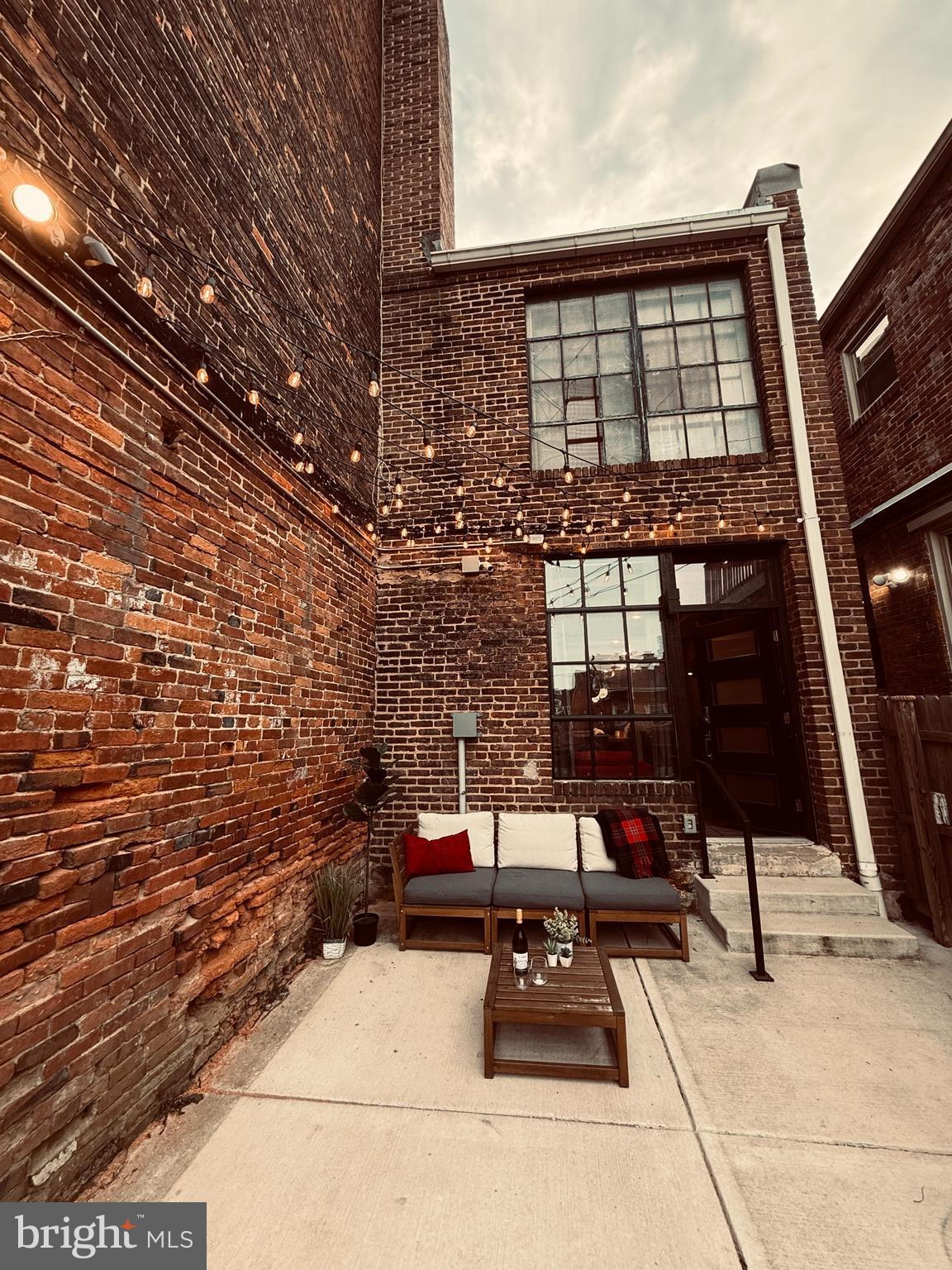 862 Tyson Street Baltimore, MD 21201 - Photo 4 of 62 a view of a patio with table and chairs and potted plants