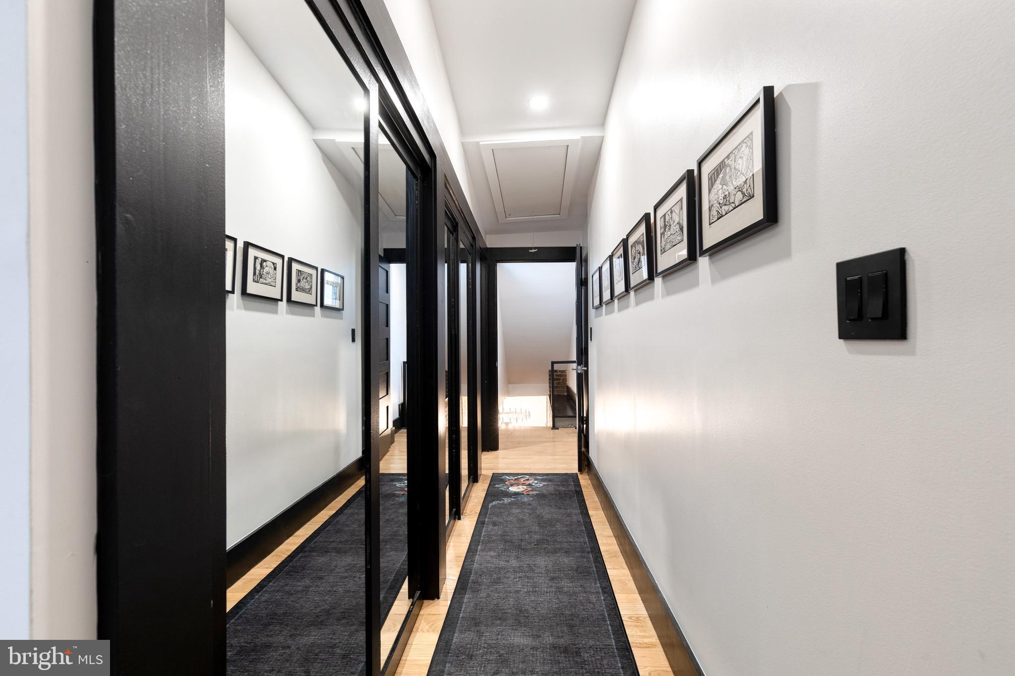 862 Tyson Street Baltimore, MD 21201 - Photo 43 of 62 a view of a hallway with wooden floor and staircase