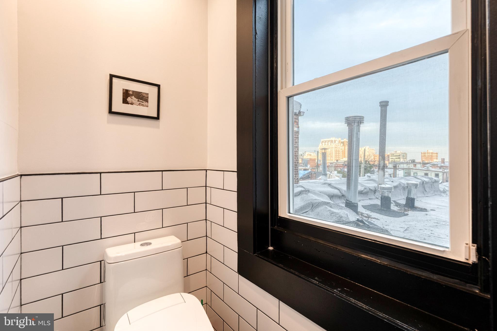 862 Tyson Street Baltimore, MD 21201 - Photo 48 of 62 a bathroom with a toilet and a shower