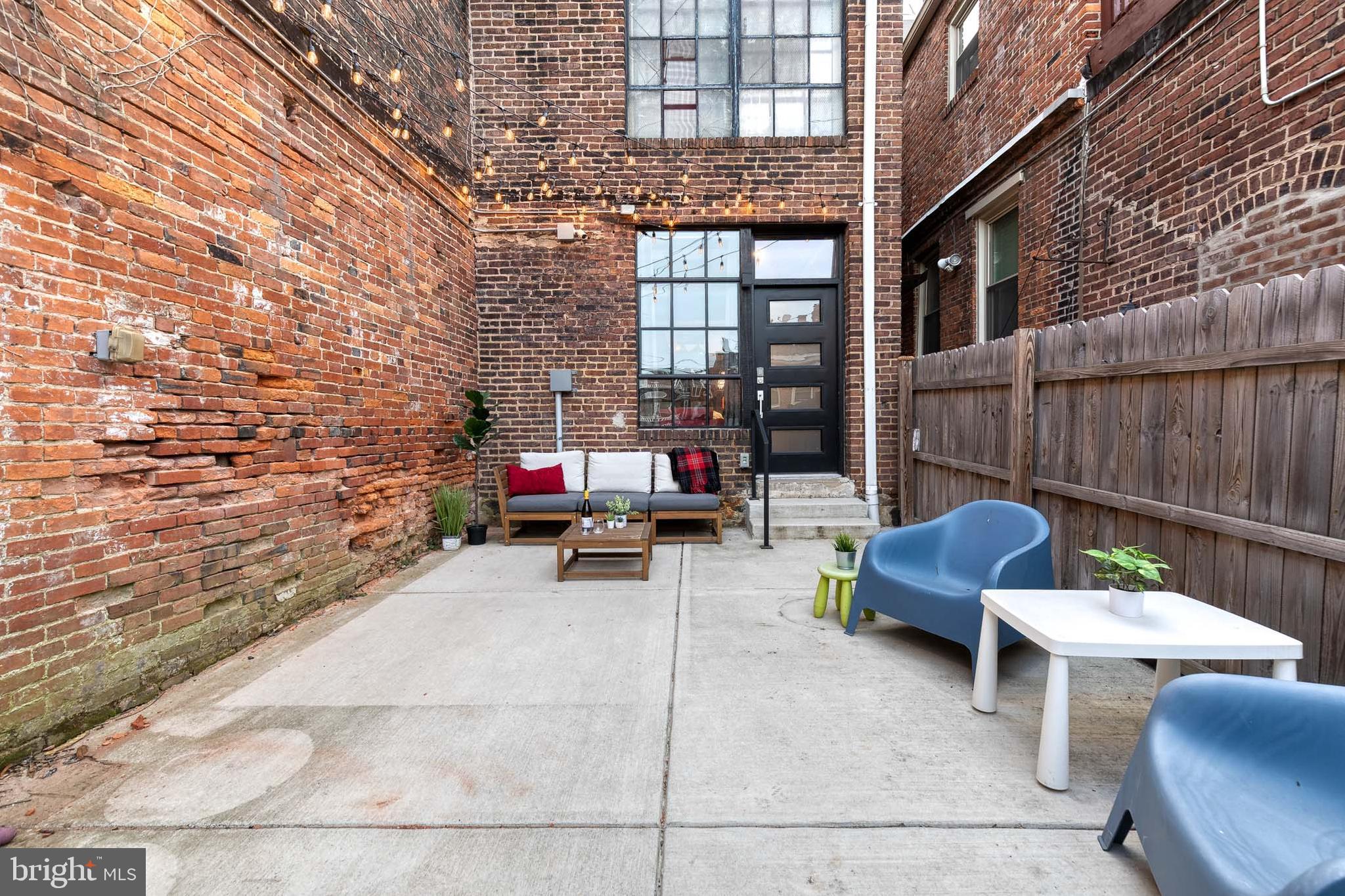 862 Tyson Street Baltimore, MD 21201 - Photo 50 of 62 a backyard of a house with outdoor seating