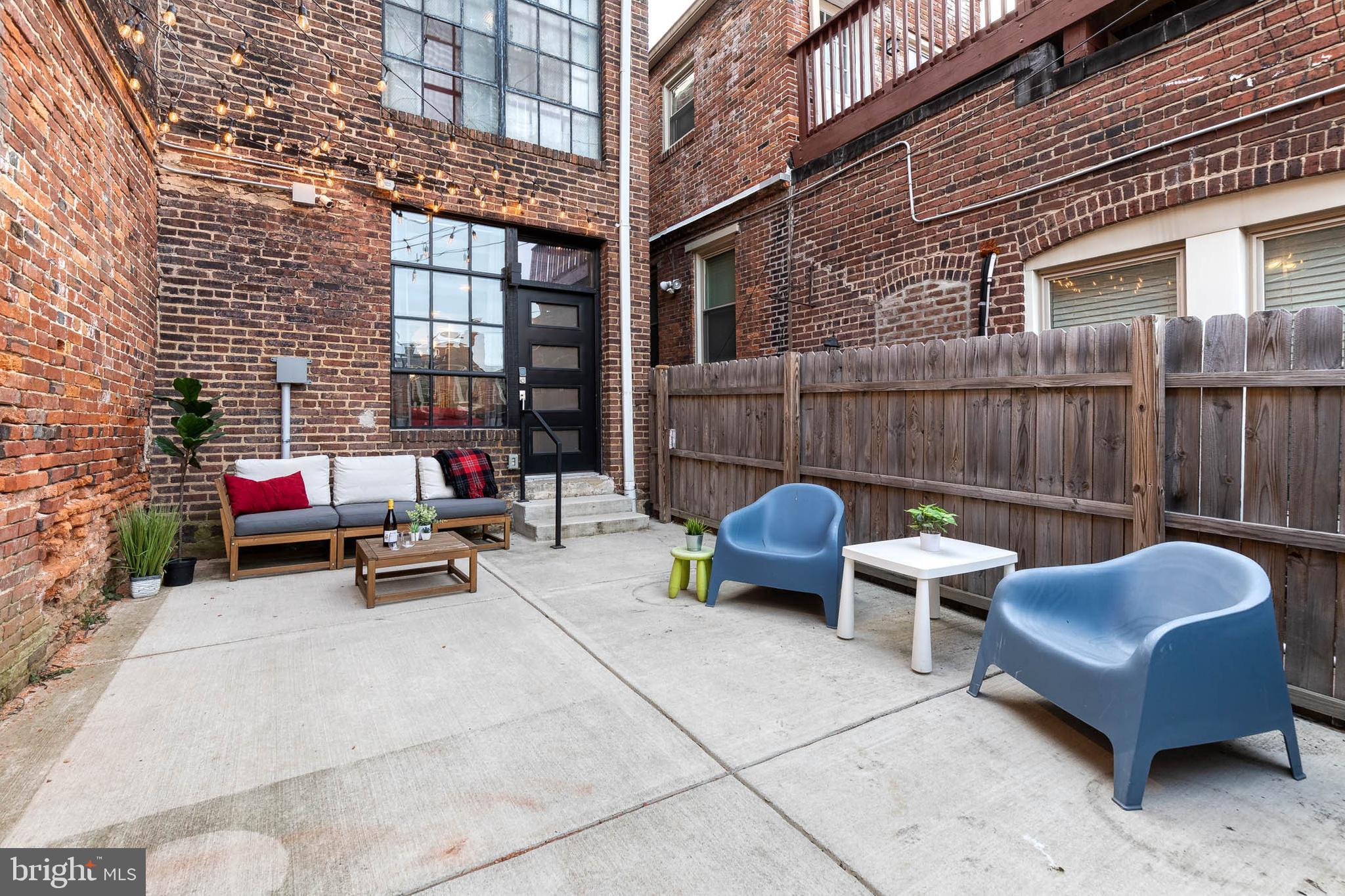 862 Tyson Street Baltimore, MD 21201 - Photo 52 of 62 a view of a patio with couple of chairs and a couch