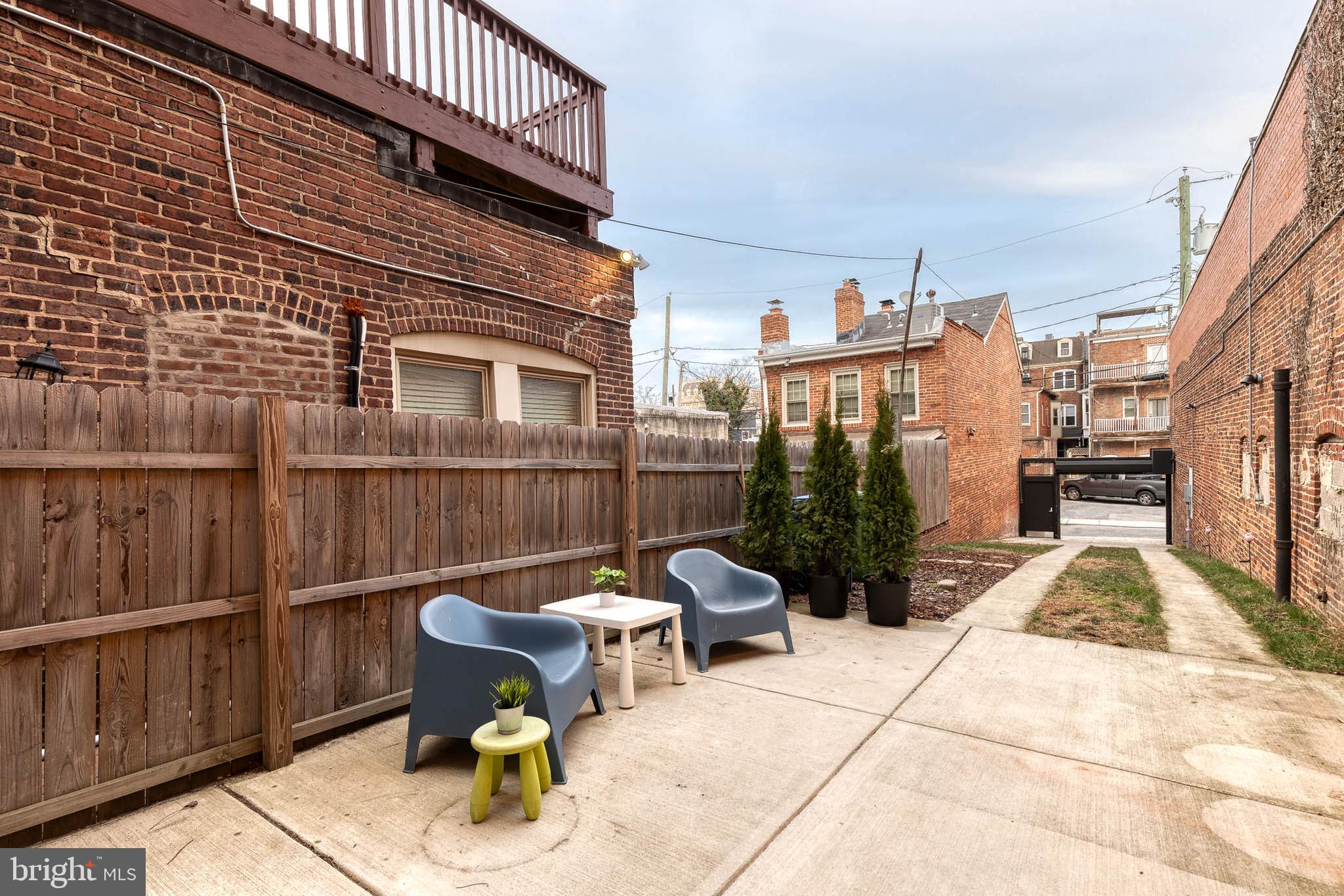 862 Tyson Street Baltimore, MD 21201 - Photo 54 of 62 a view of a chairs and tables in the balcony