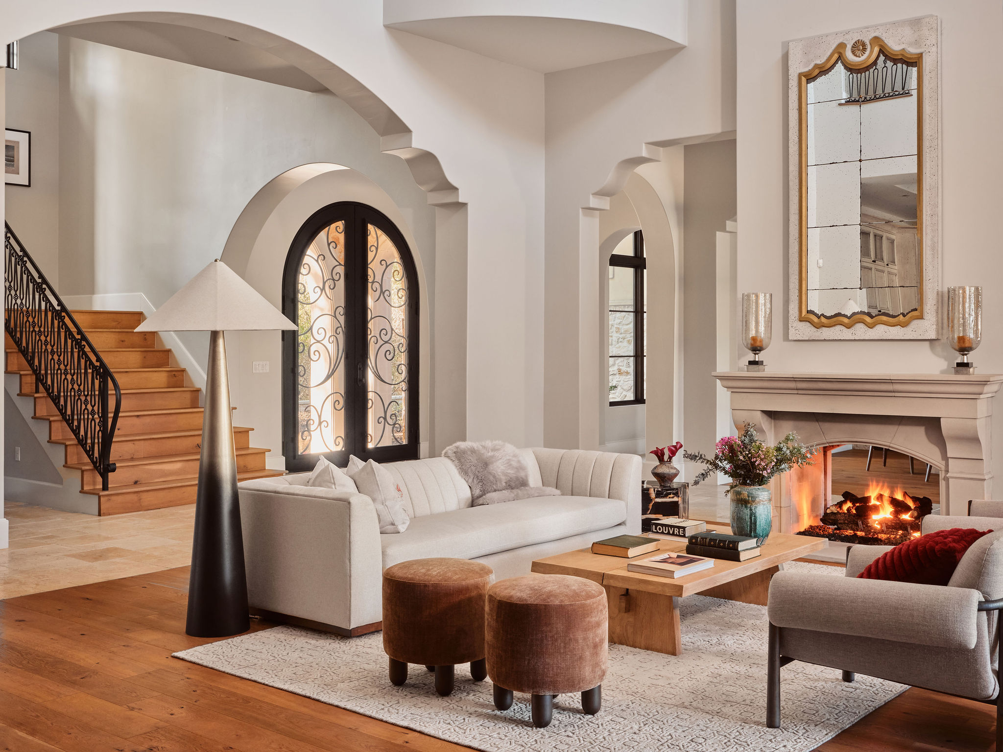 3667 Stoneridge Road Austin, TX 78746 - Photo 5 of 40 The refined living area features arched walkways, European oak floors and a dual sided fireplace.