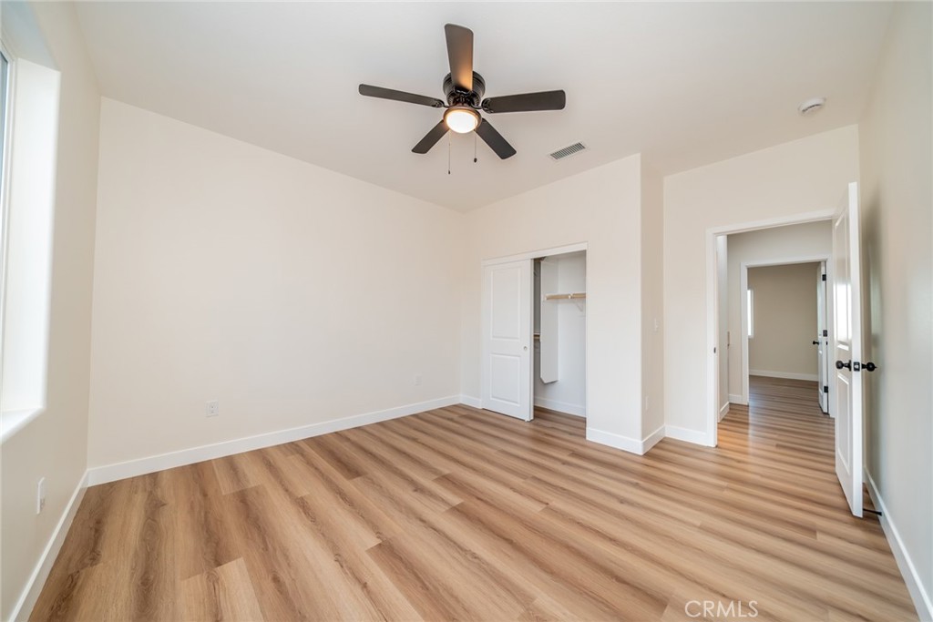 1114 Hollister Road Pinon Hills, CA 92372 - Photo 21 of 61 a view of empty room with wooden floor