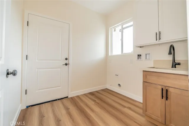 a bathroom with a toilet a sink a mirror and vanity