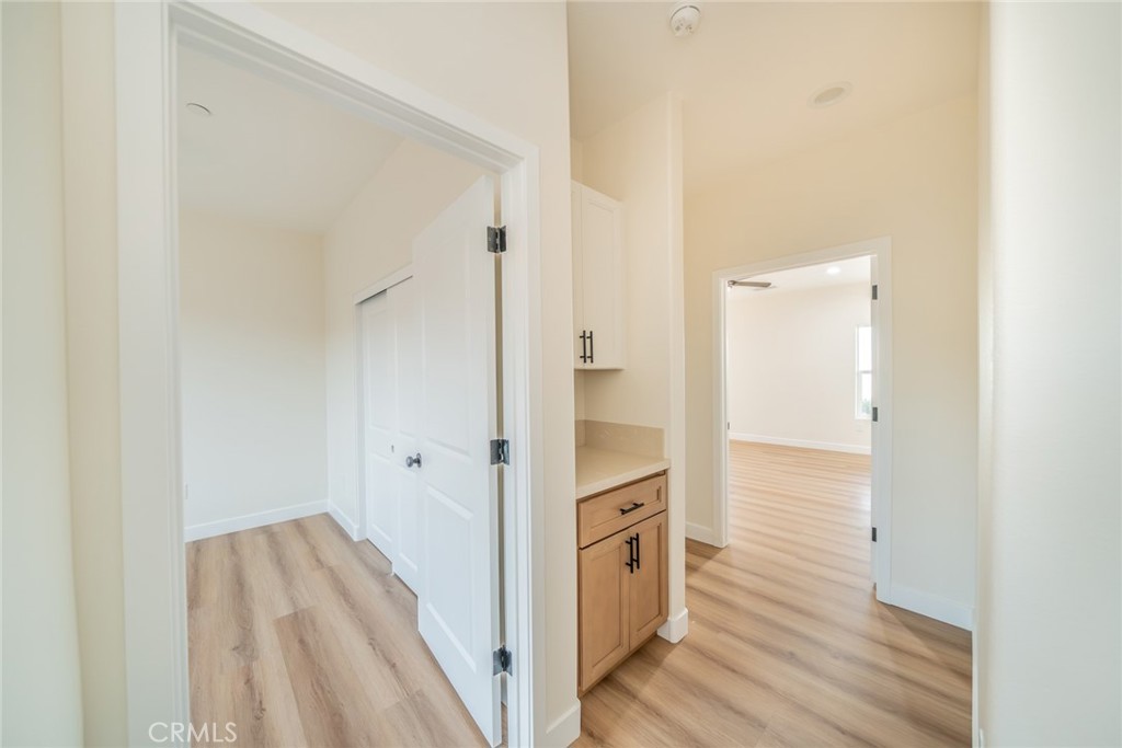 1114 Hollister Road Pinon Hills, CA 92372 - Photo 26 of 61 a view of a hallway with wooden floor