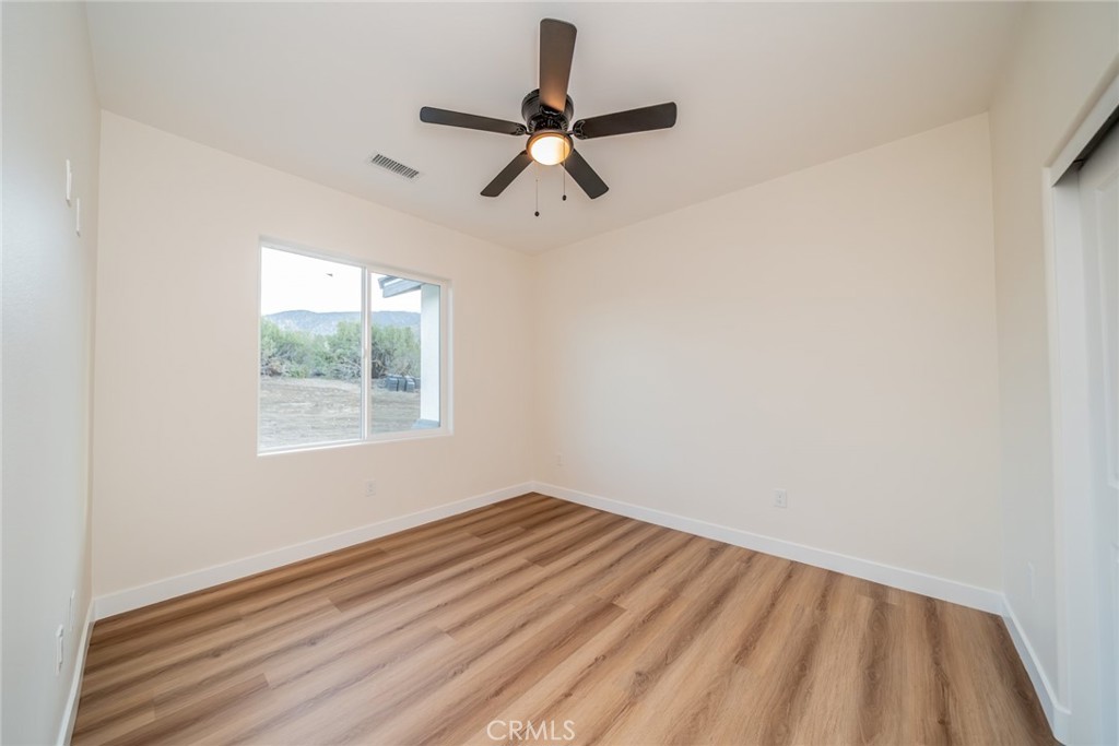 1114 Hollister Road Pinon Hills, CA 92372 - Photo 30 of 61 an empty room with a window
