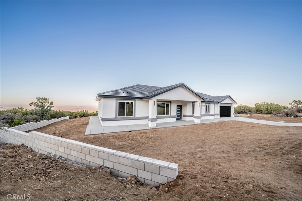 1114 Hollister Road Pinon Hills, CA 92372 - Photo 3 of 61 a house with trees in the background