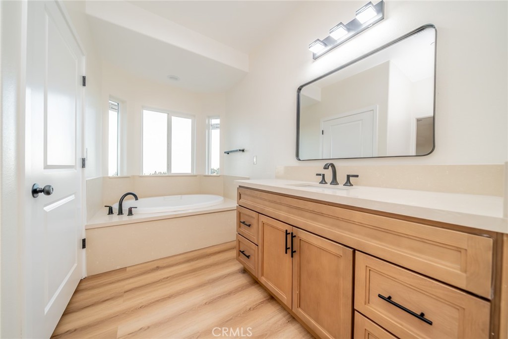 1114 Hollister Road Pinon Hills, CA 92372 - Photo 41 of 61 a spacious bathroom with a double vanity sink double mirror and a bathtub