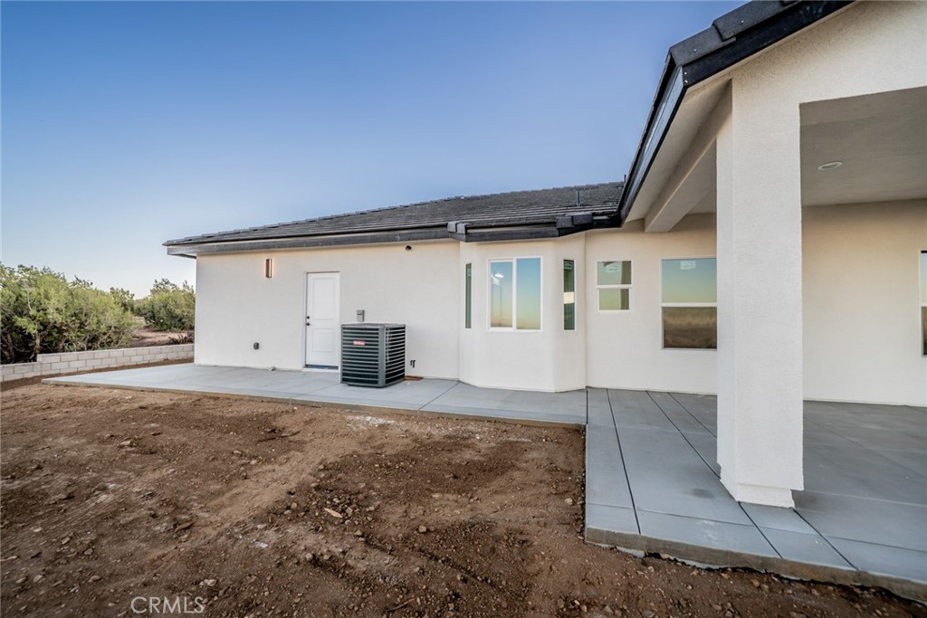 1114 Hollister Road Pinon Hills, CA 92372 - Photo 46 of 61 a view of a house with a patio