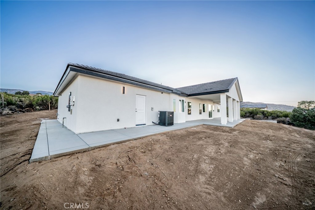 1114 Hollister Road Pinon Hills, CA 92372 - Photo 47 of 61 a house view with a backyard space