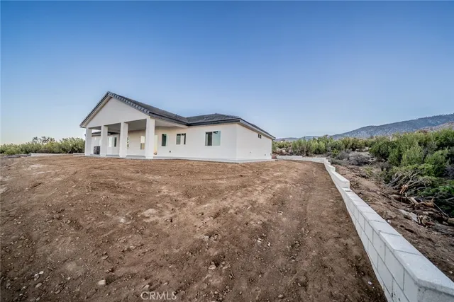 an aerial view of a house with a garden