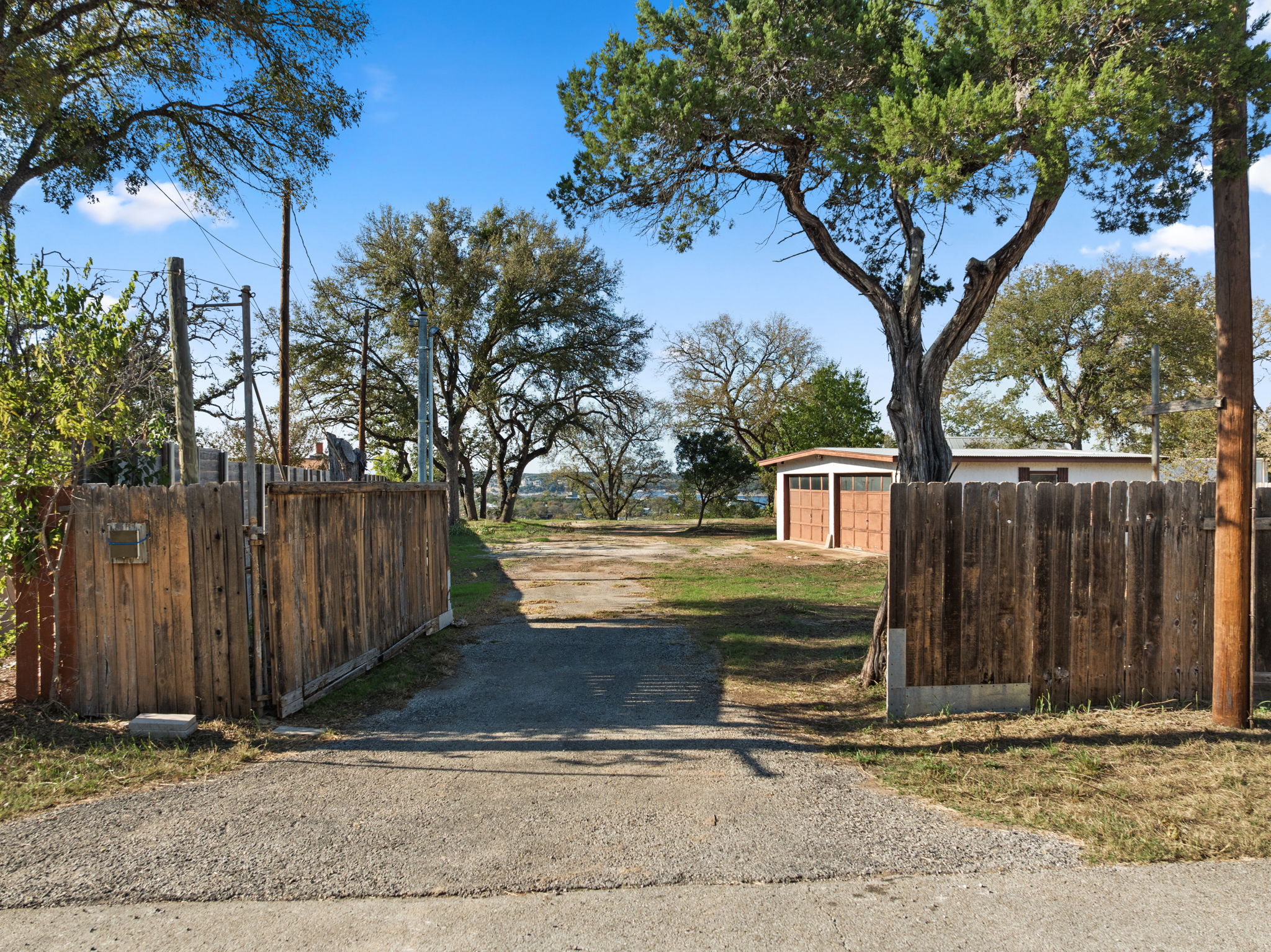 16453 Lake Loop Austin, TX 78734 - Photo 13 of 24 a front view of a house with a yard