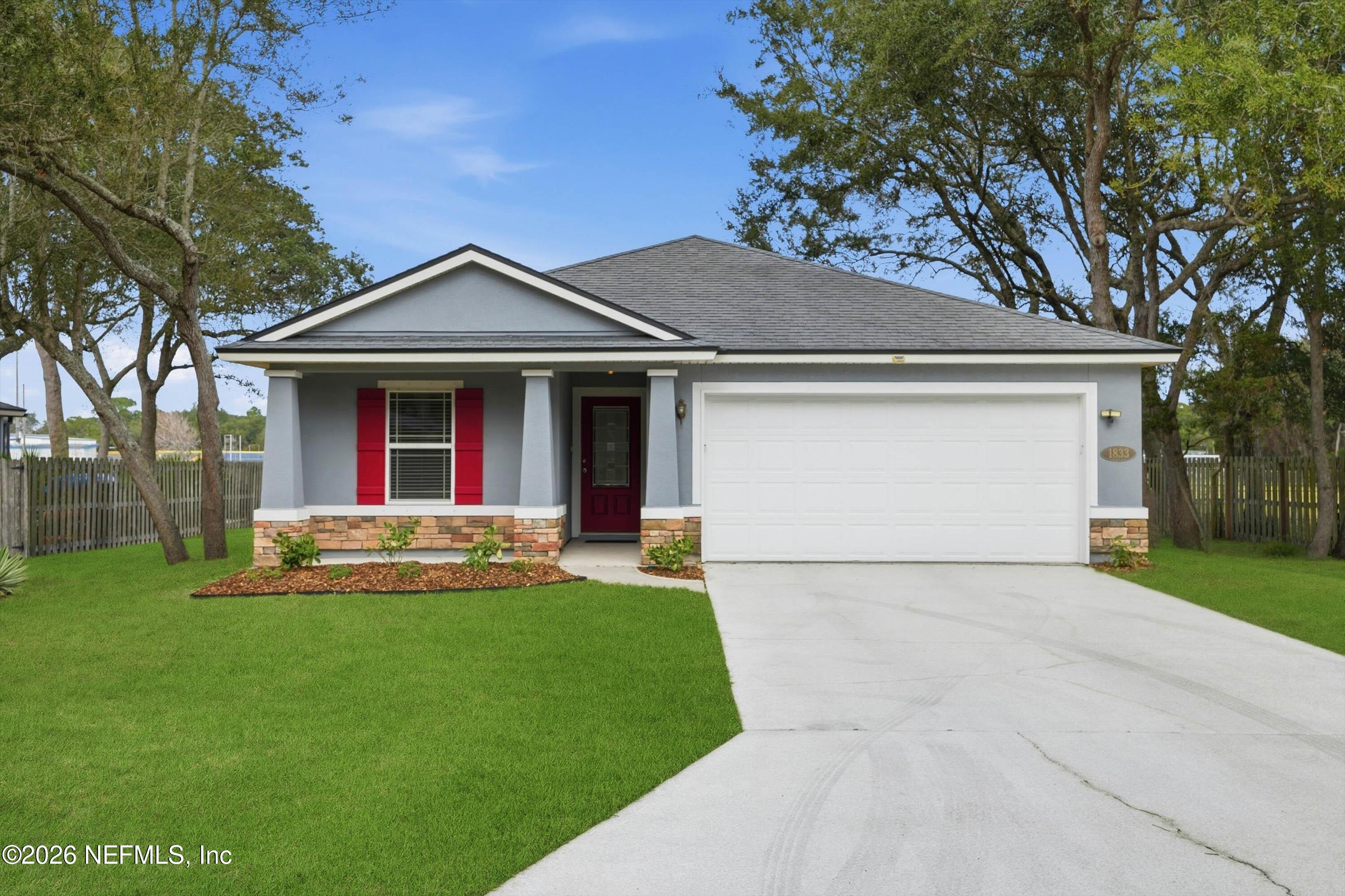 1833 Indigo Street Fernandina Beach, FL 32034 - Photo 2 of 41 a front view of house with yard and green space