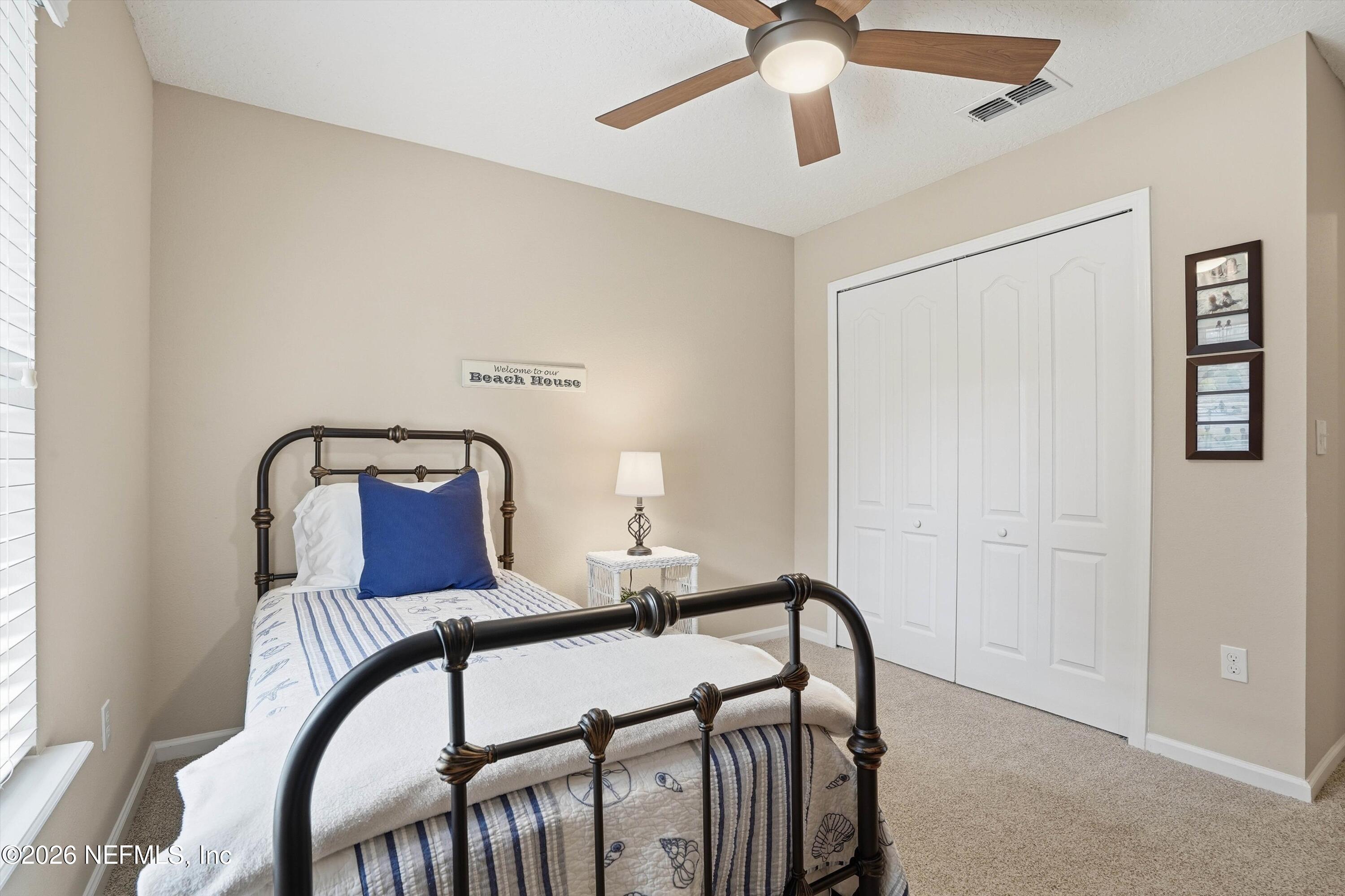 1833 Indigo Street Fernandina Beach, FL 32034 - Photo 24 of 41 a bedroom with furniture and a window