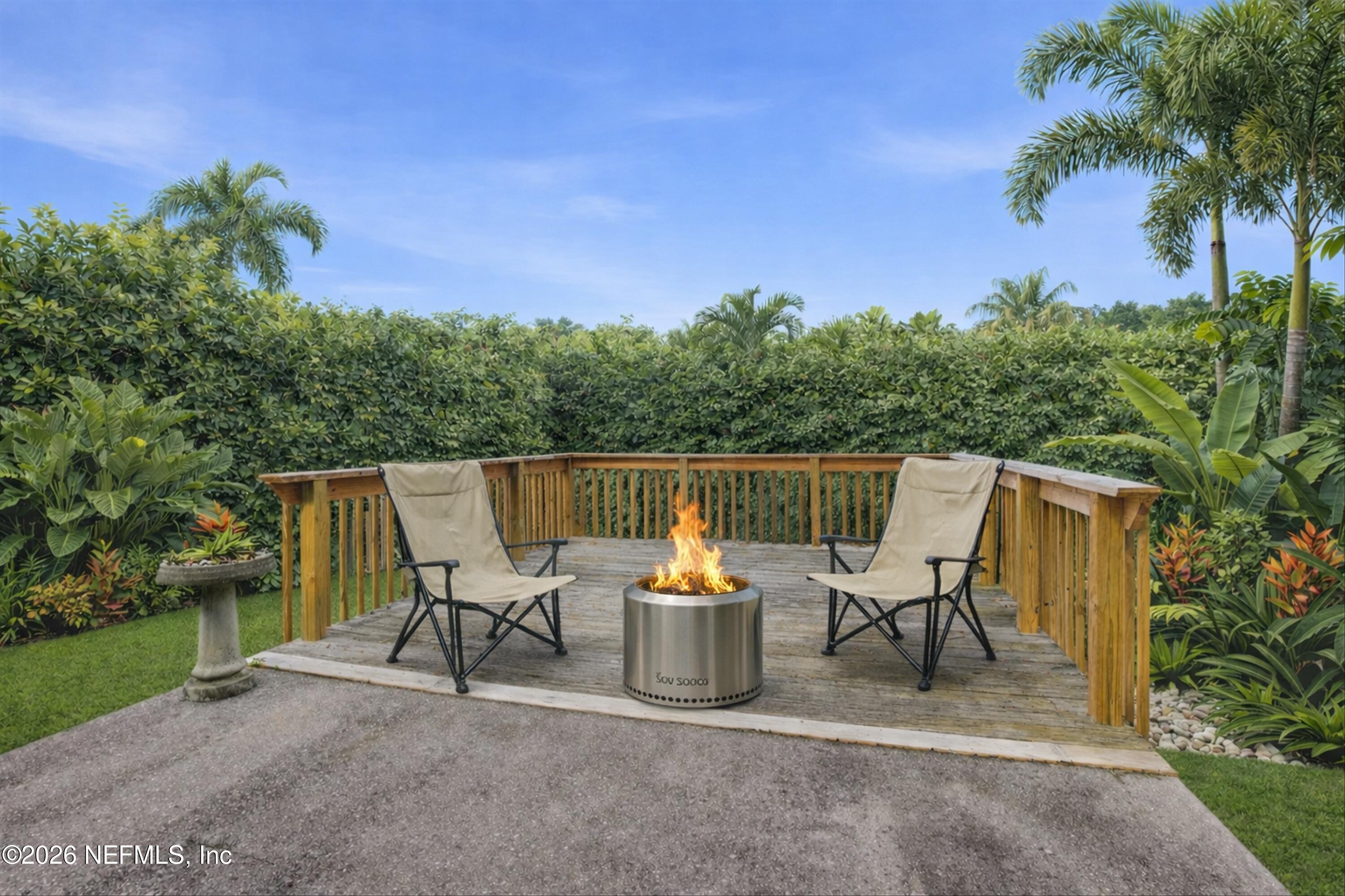 1833 Indigo Street Fernandina Beach, FL 32034 - Photo 27 of 41 a view of a chair and table in the garden