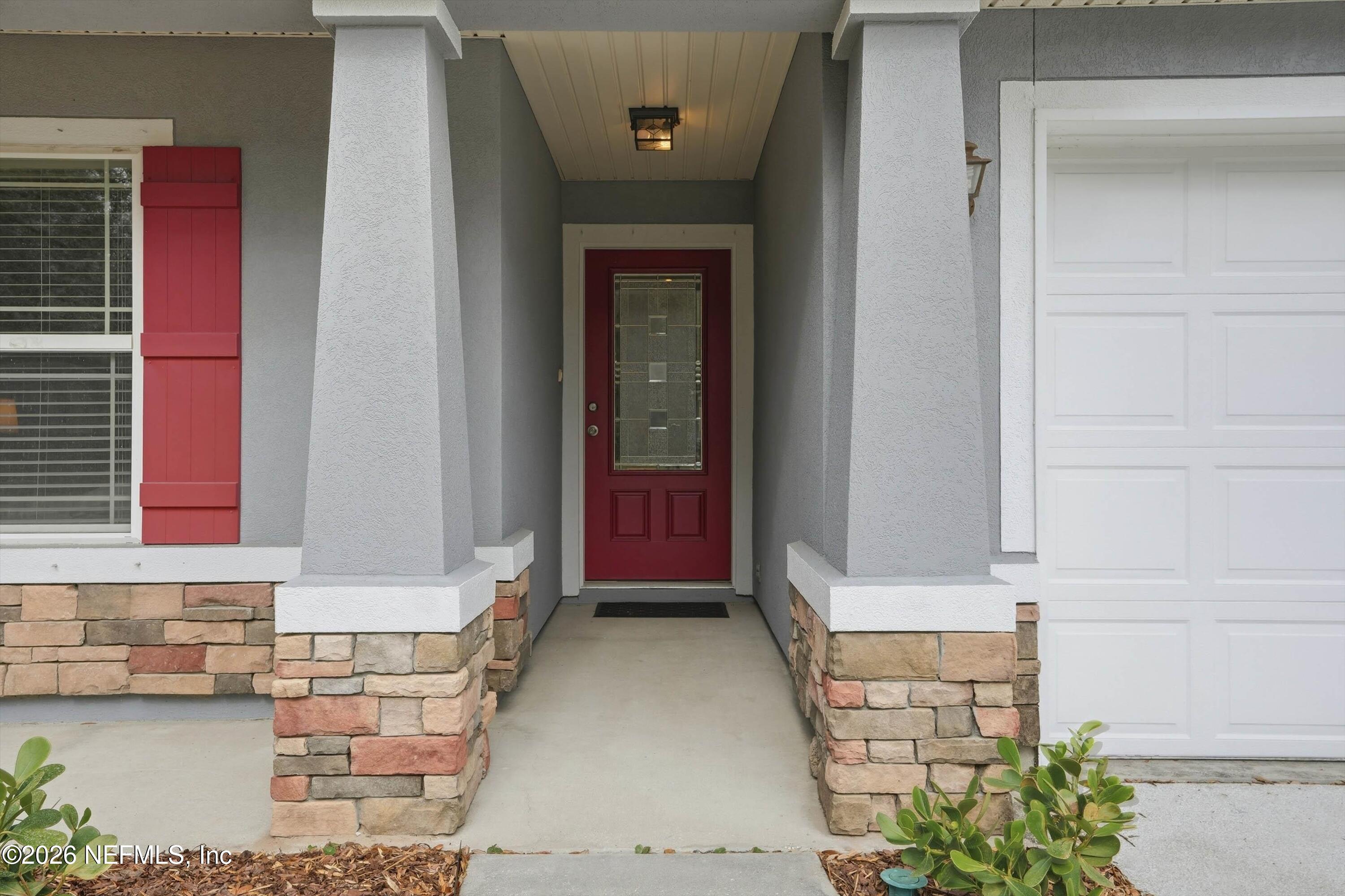 1833 Indigo Street Fernandina Beach, FL 32034 - Photo 3 of 41 a front view of a house with a yard