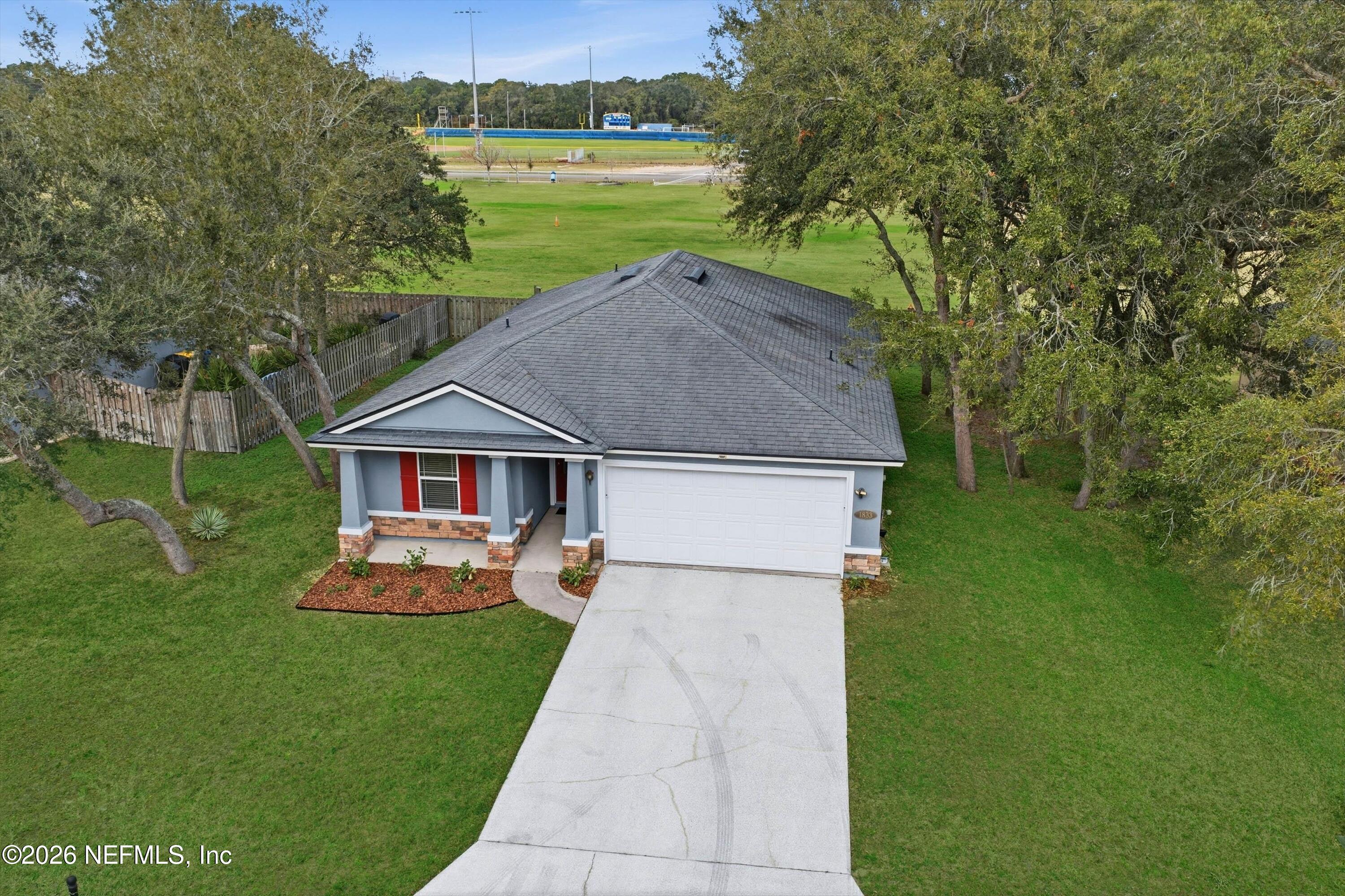 1833 Indigo Street Fernandina Beach, FL 32034 - Photo 31 of 41 a aerial view of a house with garden