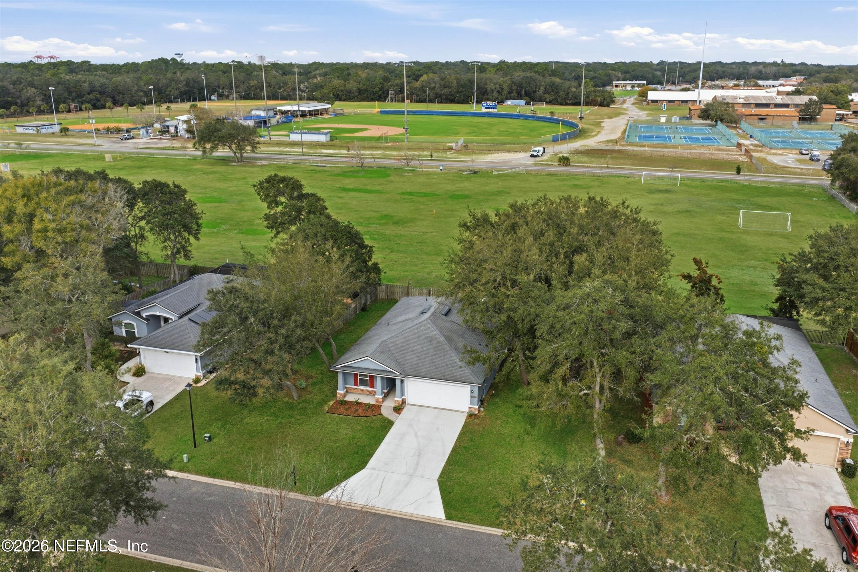 1833 Indigo Street Fernandina Beach, FL 32034 - Photo 32 of 41 an aerial view of a house with a yard lake view and mountain view