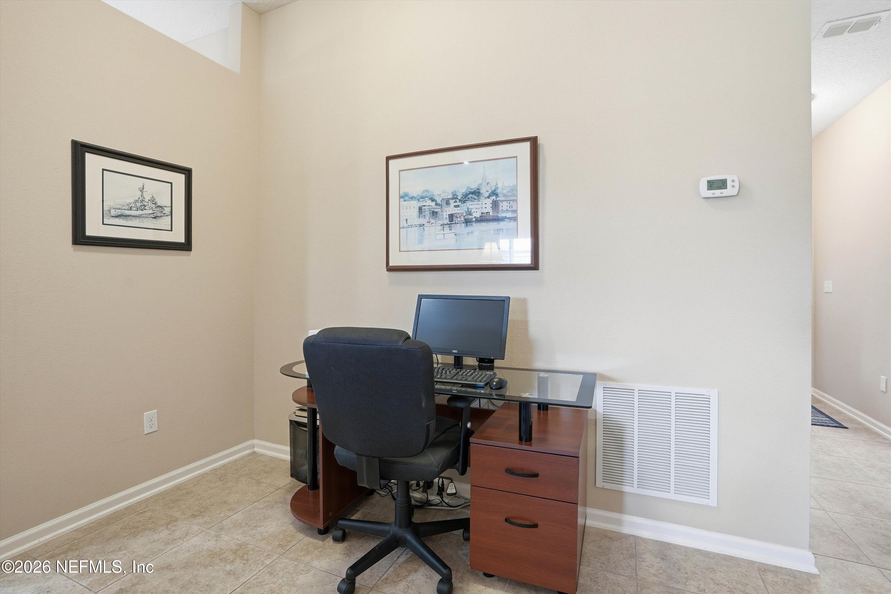 1833 Indigo Street Fernandina Beach, FL 32034 - Photo 4 of 41 a view of a workspace with furniture and a window