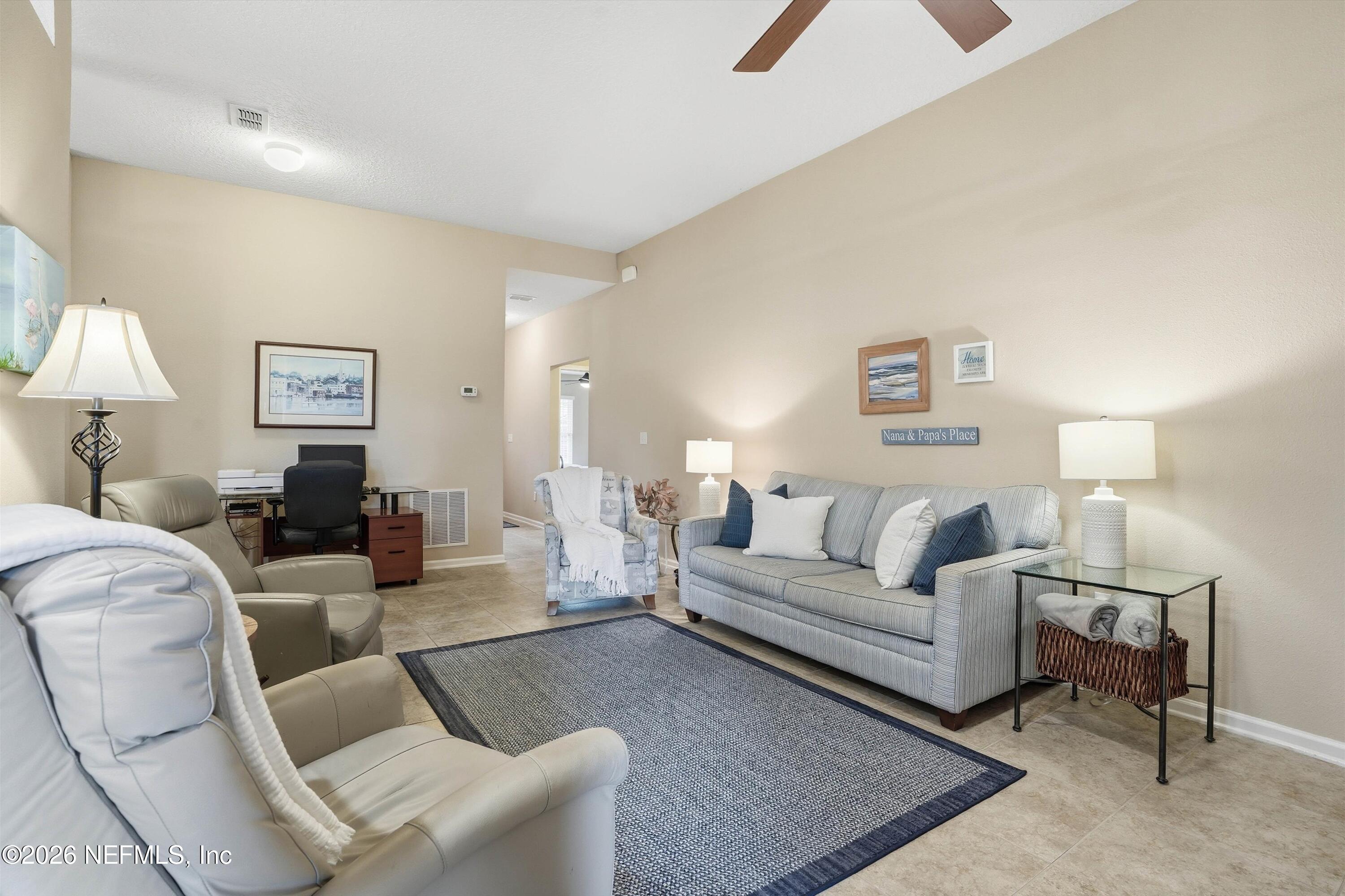 1833 Indigo Street Fernandina Beach, FL 32034 - Photo 6 of 41 a living room with furniture and a lamp