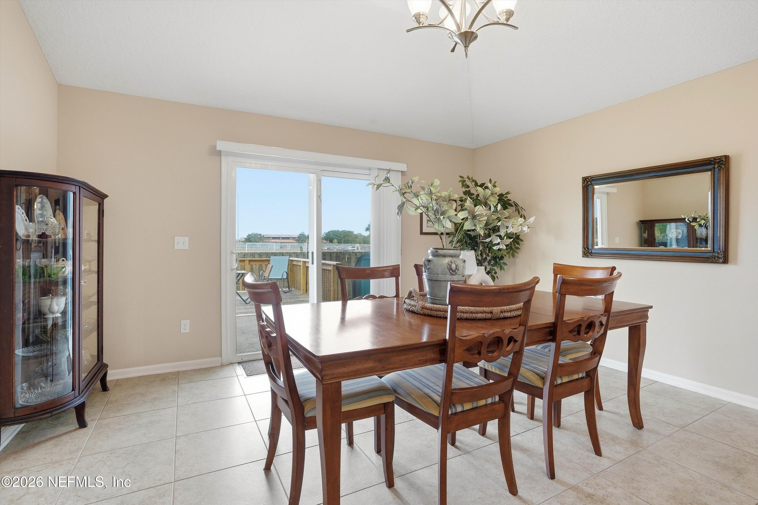 1833 Indigo Street Fernandina Beach, FL 32034 - Photo 8 of 41 a dining room with furniture and window